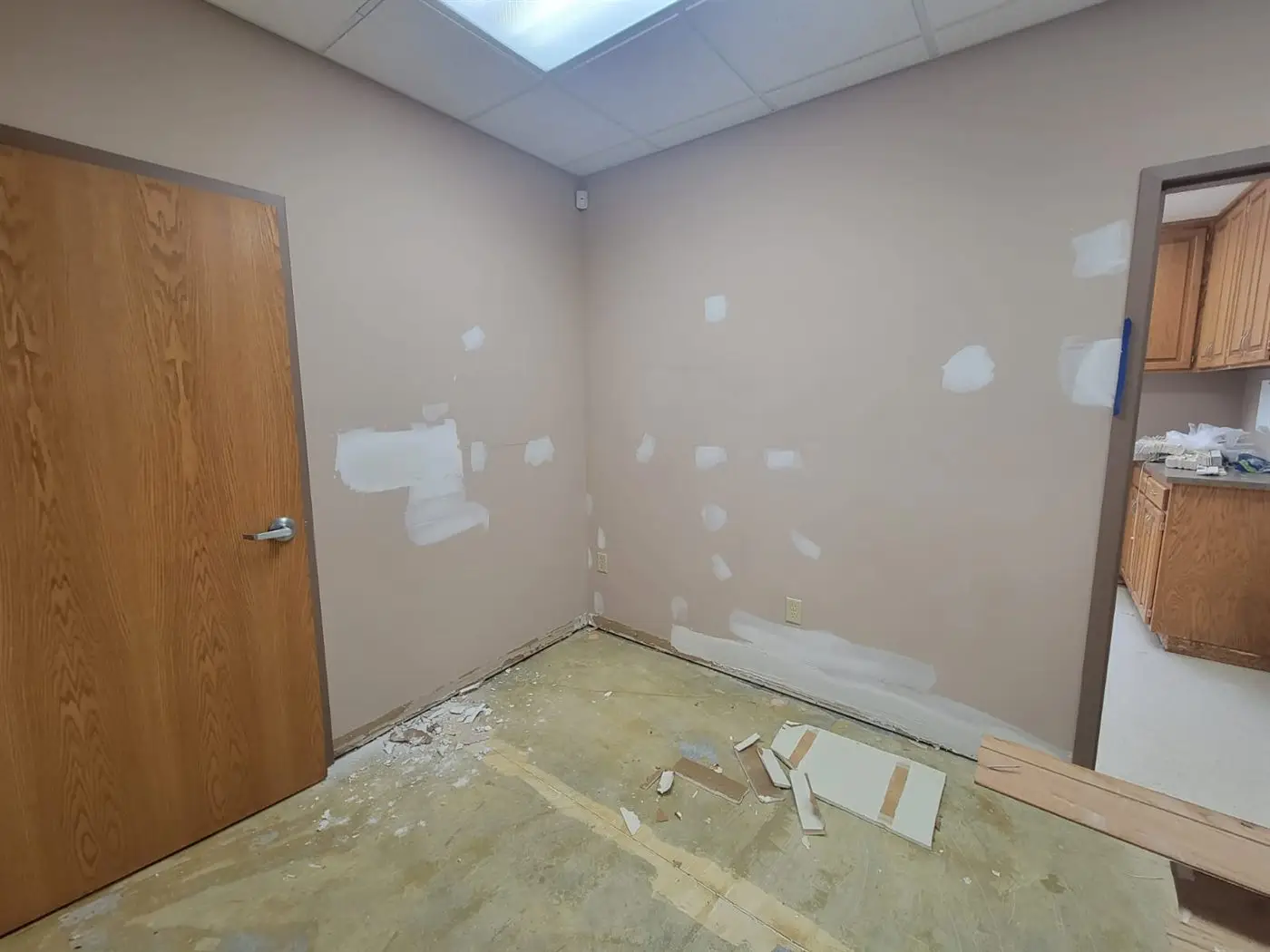 A finished room with fresh paint and natural light from a skylight