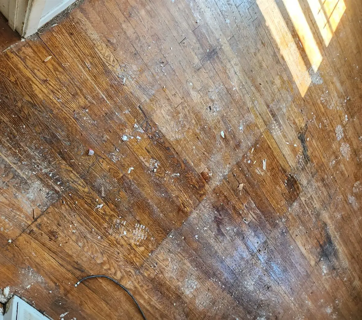 Floor stripped back before new flooring is laid