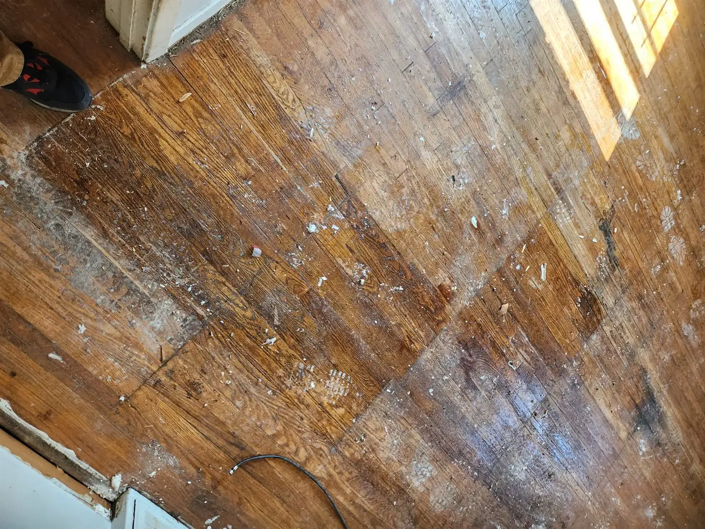 Floor stripped back before new flooring is laid