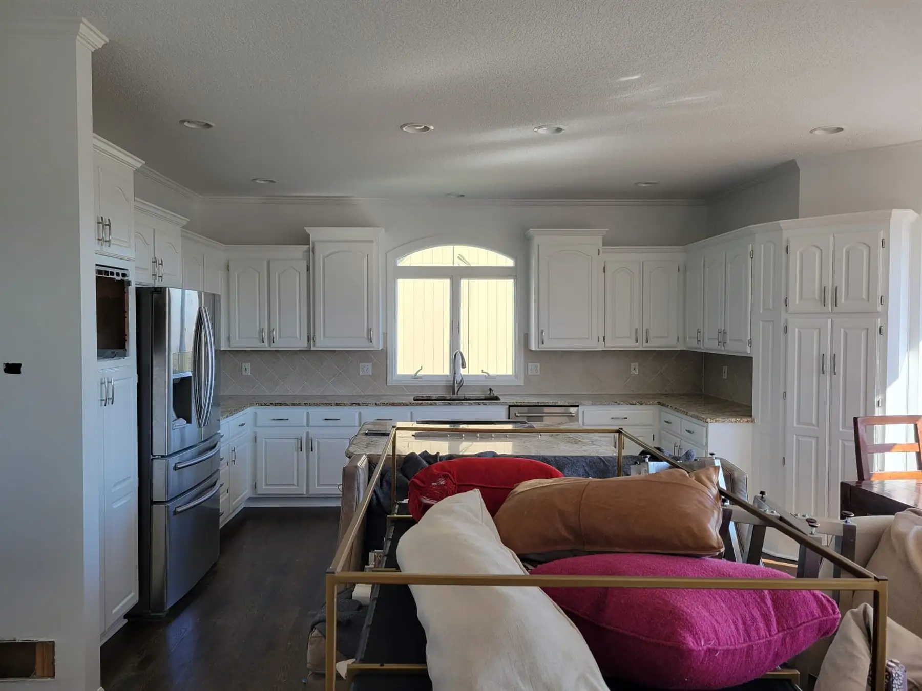 Completed kitchen with fitted cabinets and appliances
